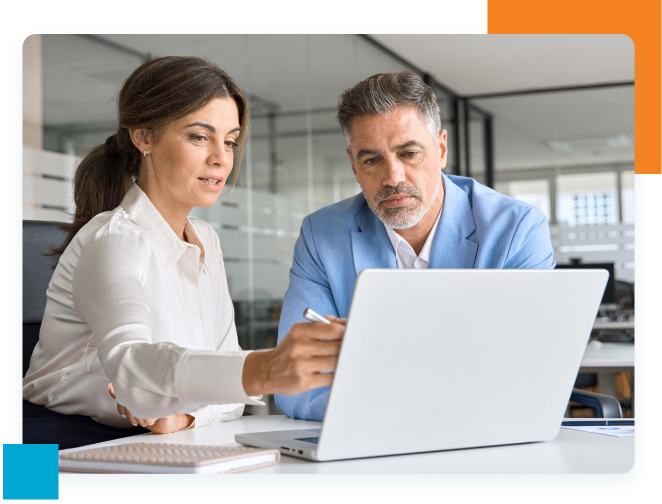 Two professionals looking at laptop