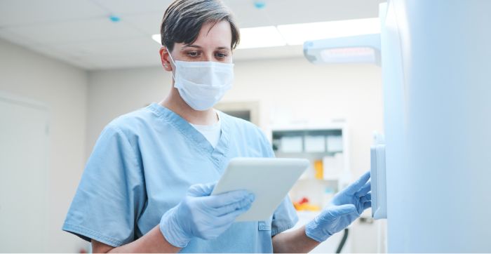 surgeon looking at tablet